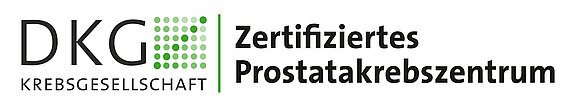 Logo der Deutschen Krebsgesellschaft (DKG) mit grünem Punktraster und Schriftzug: „Zertifiziertes Prostatakrebszentrum“.