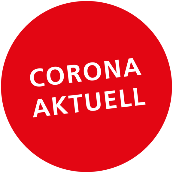 Runder roter Hintergrund mit dem Text "CORONA AKTUELL" in weißer Schrift.